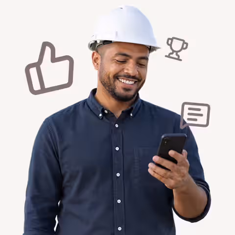 Smiling contractor in a hard hat on his phone, with thumbs up, trophy and message icons