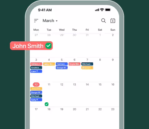 Month calendar on a phone showing booked visits per day