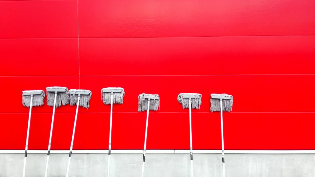 philosophical claning quotes. seven white push mops on wall